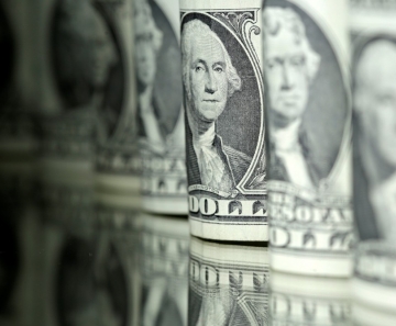 Dólar opera em queda, negociado abaixo de R$ 5,55